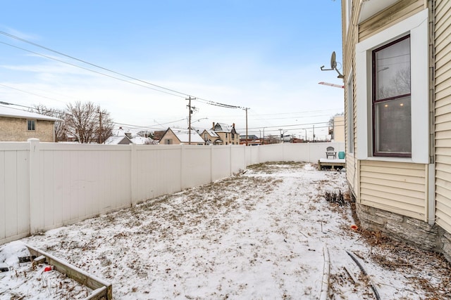 view of yard layered in snow