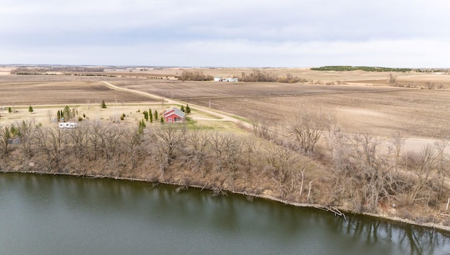 birds eye view of property with a rural view and a water view