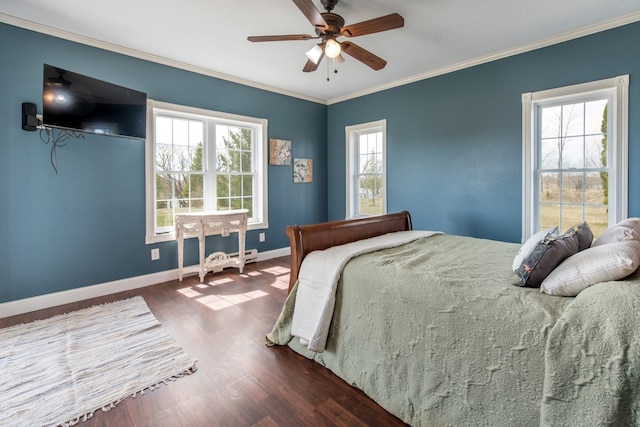 bedroom featuring dark hardwood / wood-style flooring, ornamental molding, and ceiling fan