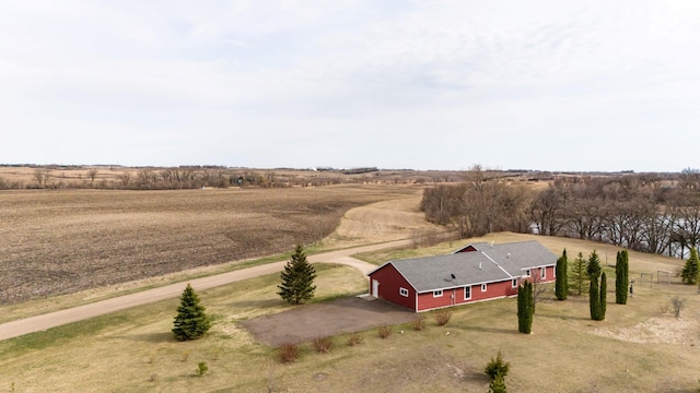 birds eye view of property featuring a rural view