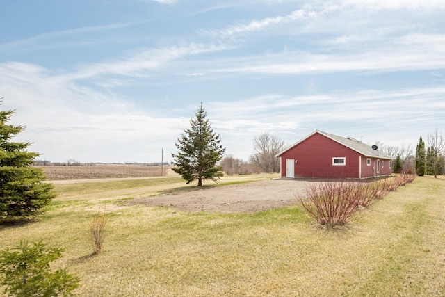 view of yard with a rural view