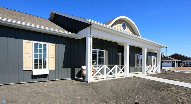 doorway to property featuring covered porch