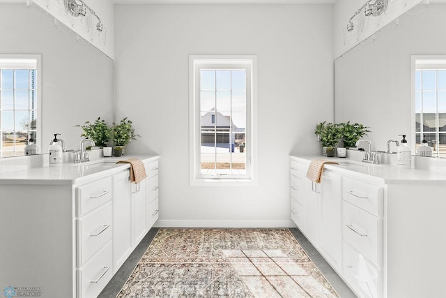 bathroom featuring sink and a healthy amount of sunlight