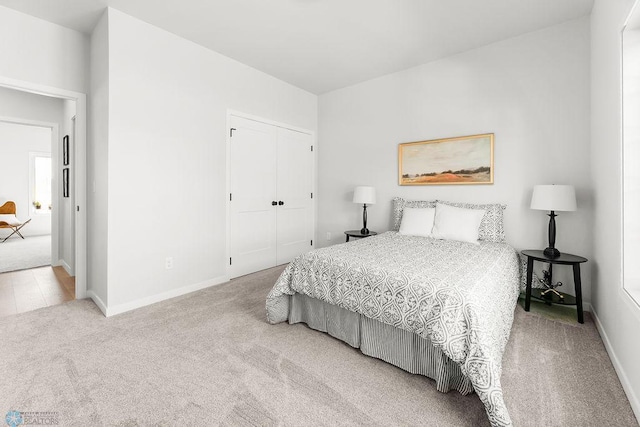 carpeted bedroom with a closet