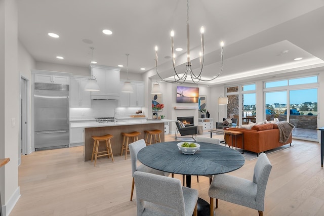 1 Hill Farm Rd Unit 107, North Oaks, MN 55127 - dining space with recessed lighting, light wood finished floors, and a warm lit fireplace