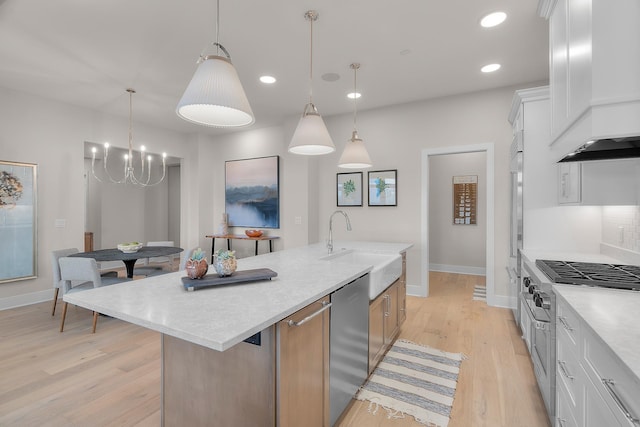 1 Hill Farm Rd Unit 107, North Oaks, MN 55127 - kitchen with a sink, appliances with stainless steel finishes, a center island with sink, and light countertops