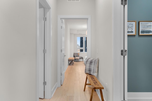 1 Hill Farm Rd Unit 107, North Oaks, MN 55127 - hallway with visible vents, light wood-style flooring, and baseboards