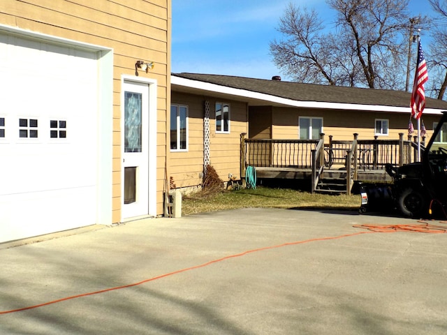 view of side of home featuring a wooden deck