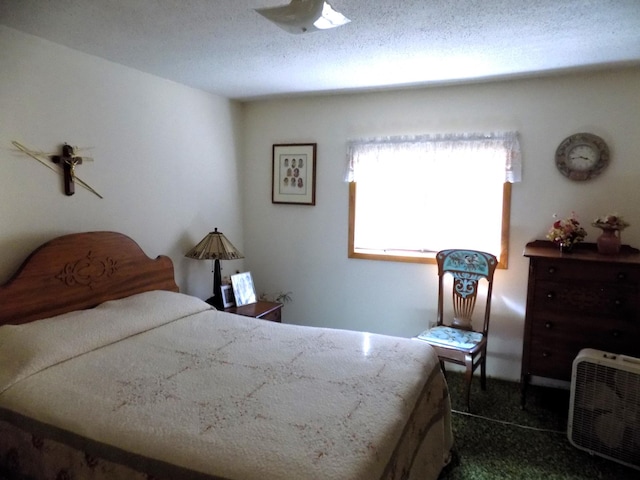 carpeted bedroom with a textured ceiling