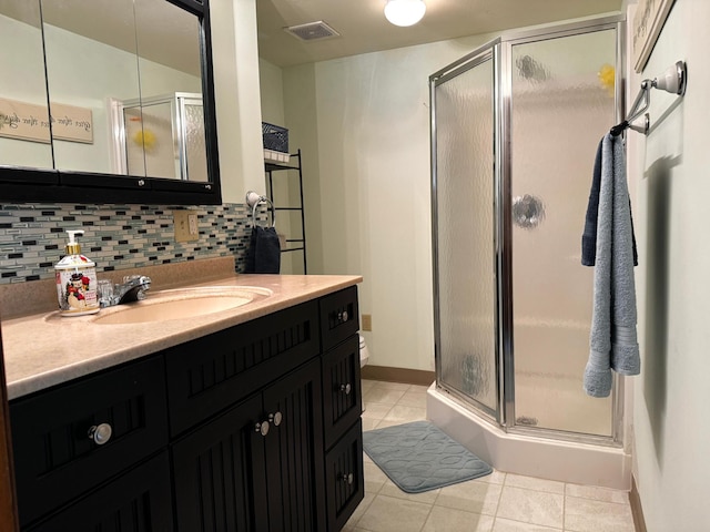 full bathroom featuring a shower stall, backsplash, visible vents, and tile patterned floors