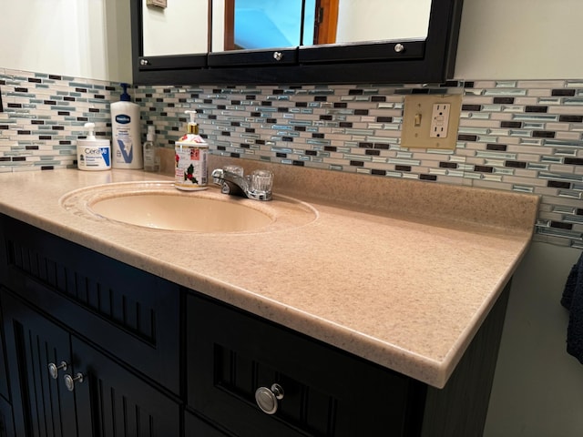 interior space featuring backsplash and vanity