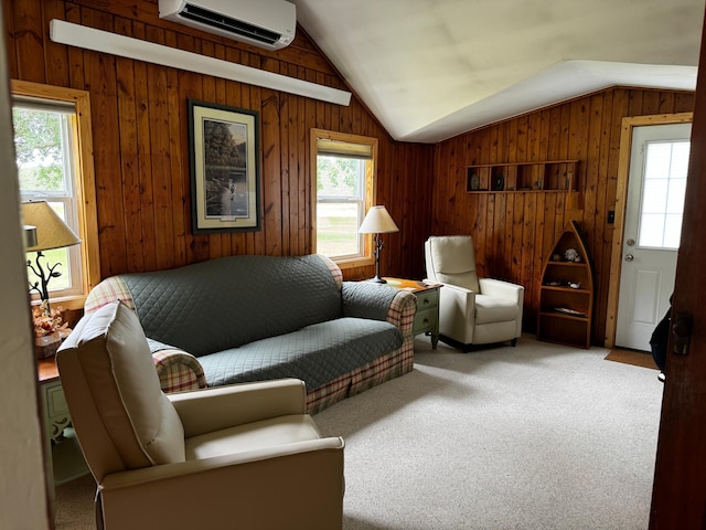 living area with carpet, a wall unit AC, lofted ceiling, and a wealth of natural light