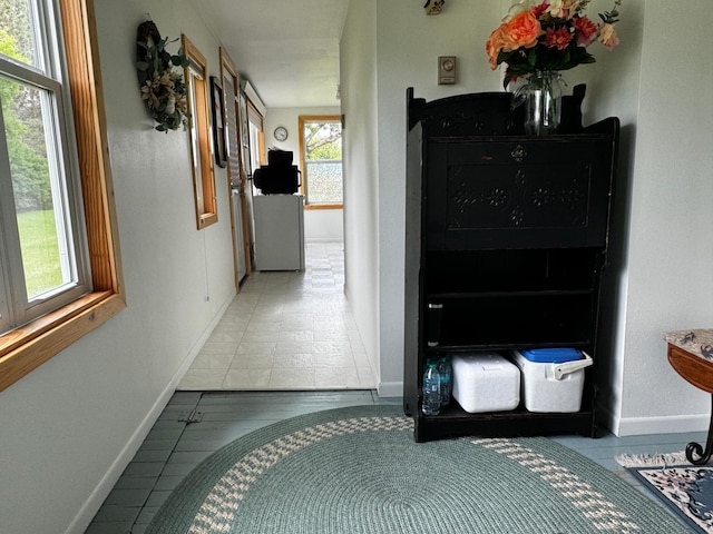 hallway featuring baseboards