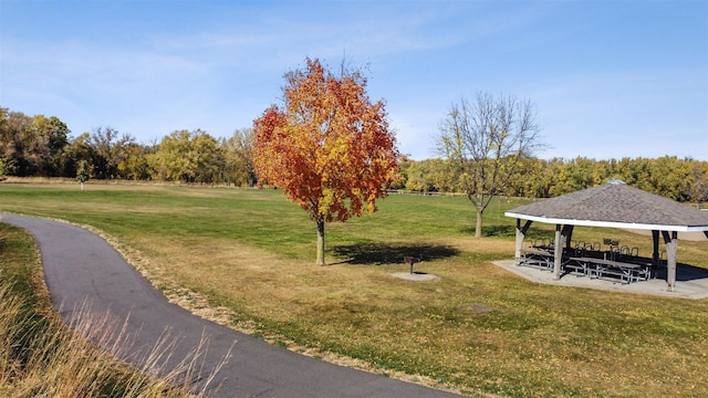 surrounding community with a gazebo and a lawn