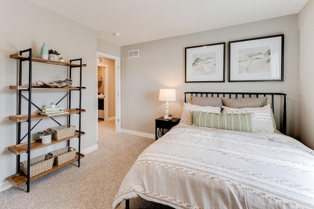 bedroom with light colored carpet