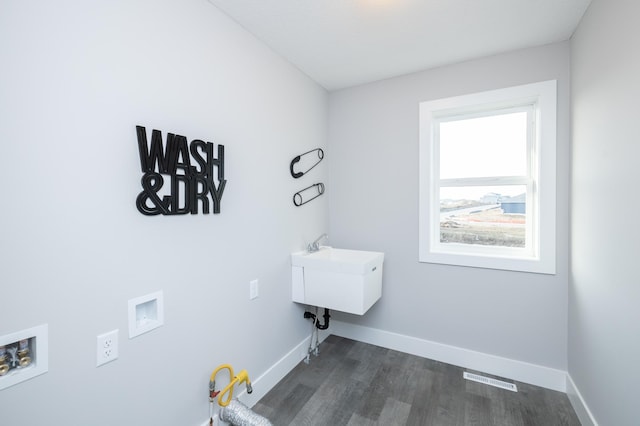 laundry room with hookup for a washing machine and dark hardwood / wood-style floors