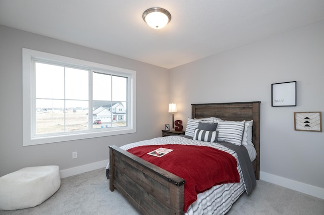 bedroom featuring light carpet