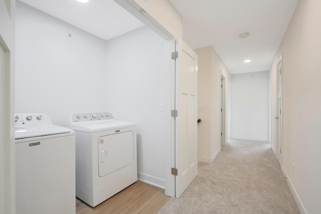 washroom with light carpet and independent washer and dryer