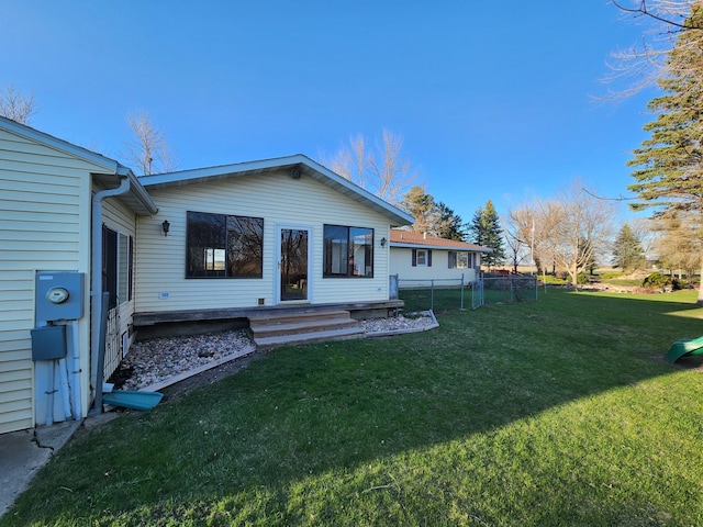 rear view of house with a lawn