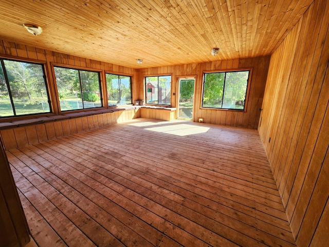 unfurnished sunroom featuring wooden ceiling