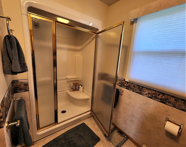 bathroom featuring an enclosed shower