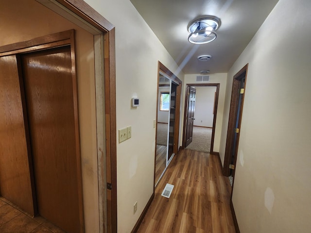 hall featuring wood-type flooring