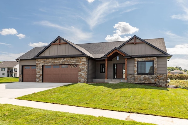 craftsman inspired home featuring a front yard and a garage