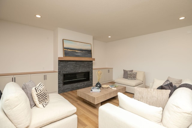 living room with a fireplace and light hardwood / wood-style floors