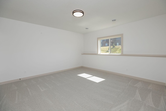 unfurnished room featuring carpet