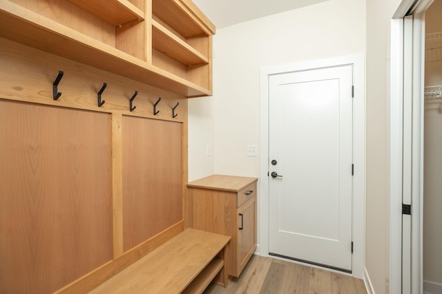 mudroom with light hardwood / wood-style floors