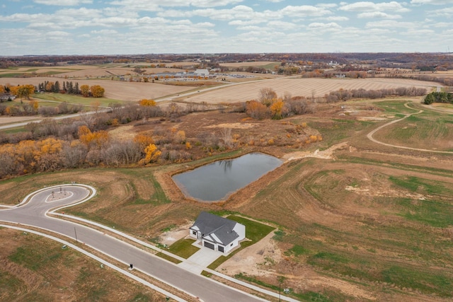 aerial view with a water view and a rural view