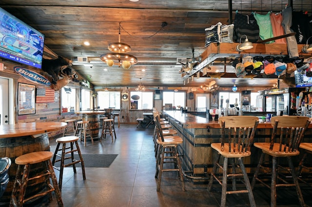 dining room featuring wood ceiling