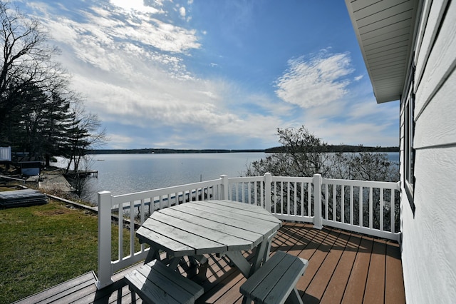 wooden terrace with a water view