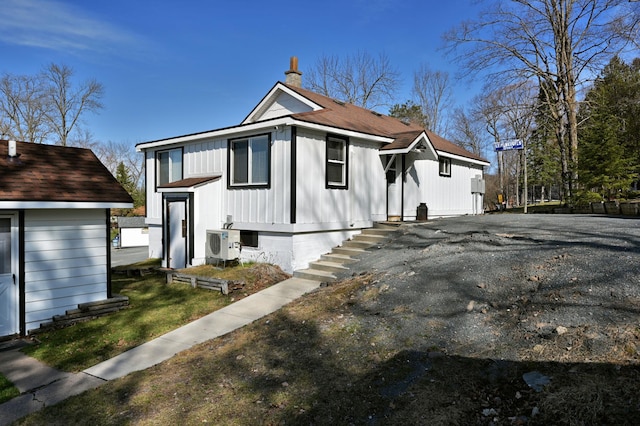 view of front of property featuring ac unit