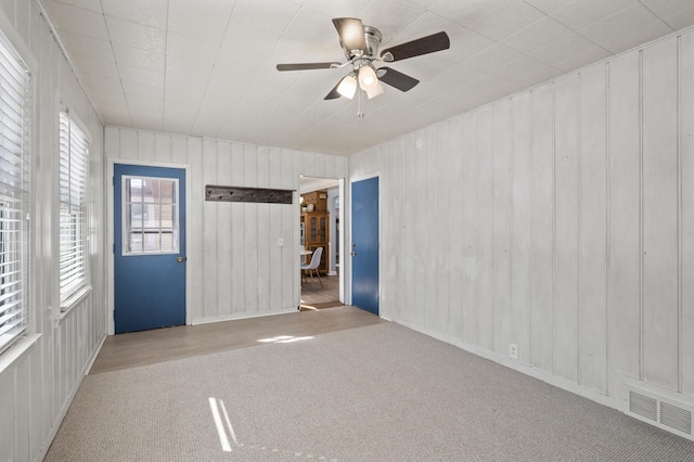 carpeted empty room with ceiling fan