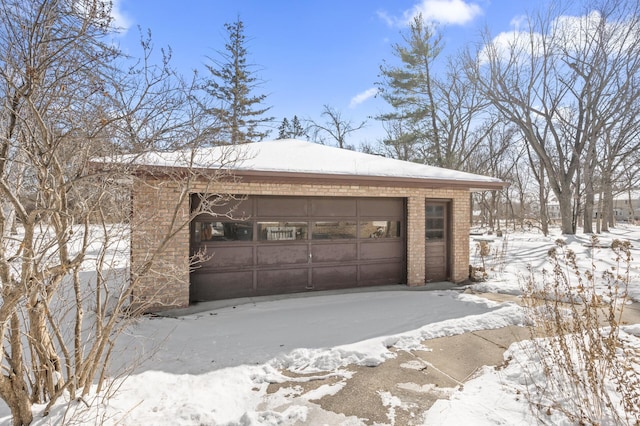 view of snow covered garage