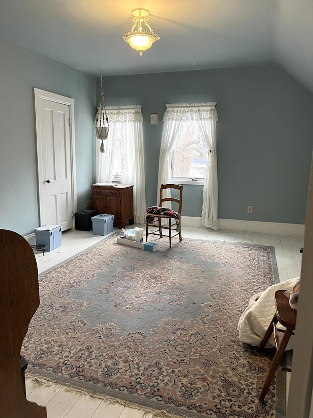 sitting room featuring lofted ceiling