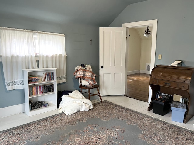 bedroom featuring lofted ceiling and light hardwood / wood-style flooring