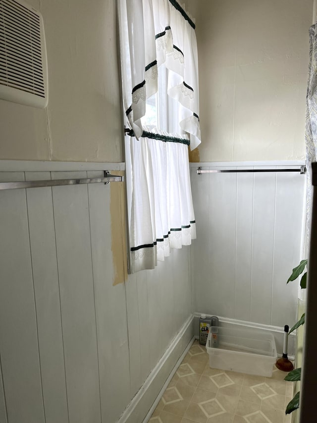 bathroom with tile flooring