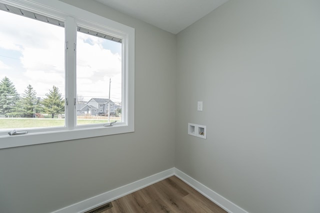 washroom featuring hookup for a washing machine and hardwood / wood-style floors