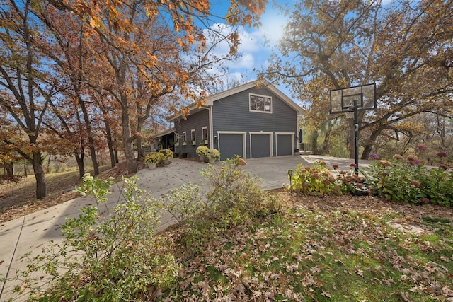 view of side of property featuring a garage