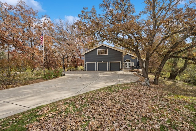 view of side of property featuring a garage