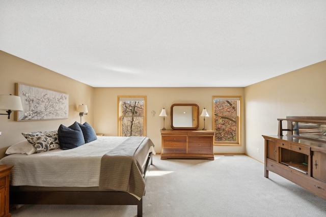 bedroom with light colored carpet