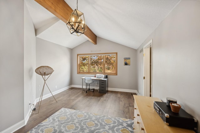 office space with vaulted ceiling with beams, hardwood / wood-style flooring, and an inviting chandelier