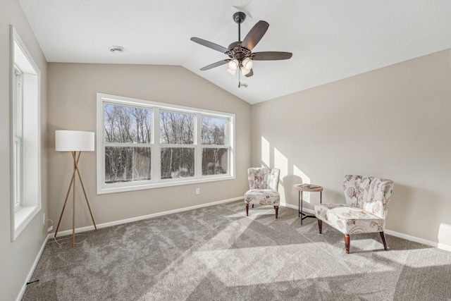 sitting room featuring carpet, ceiling fan, and vaulted ceiling