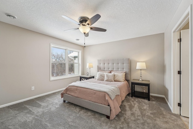 carpeted bedroom with a textured ceiling and ceiling fan