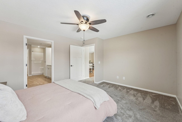 bedroom featuring ensuite bath, ceiling fan, and light colored carpet