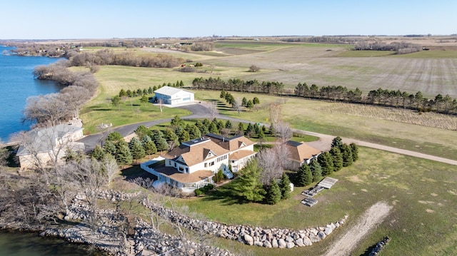 birds eye view of property featuring a water view and a rural view
