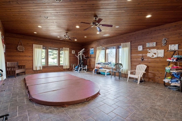 game room with a wealth of natural light, tile flooring, ceiling fan, and wooden ceiling