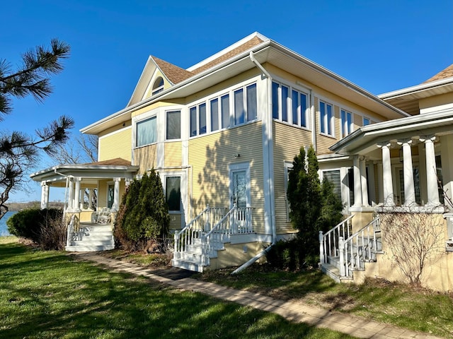 exterior space with a lawn and covered porch